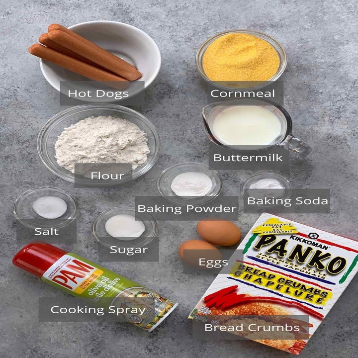 Ingredients for corn dogs in little bowls.